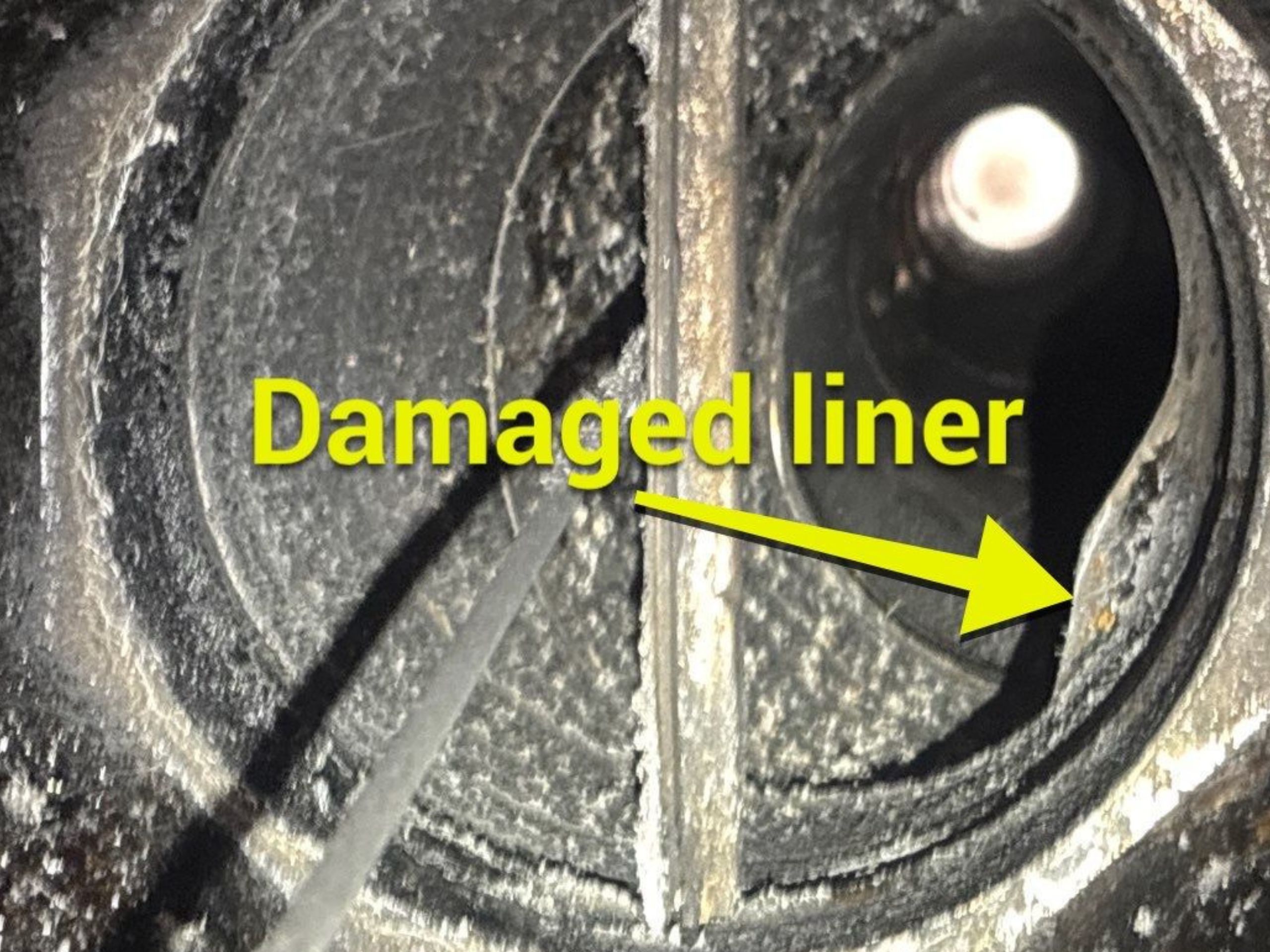 Liner in wood burning fireplace is damaged