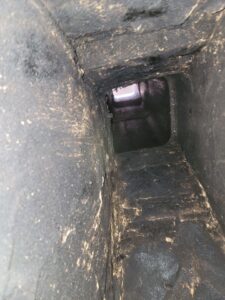 cracks in the flue system with heavy glazed creosote