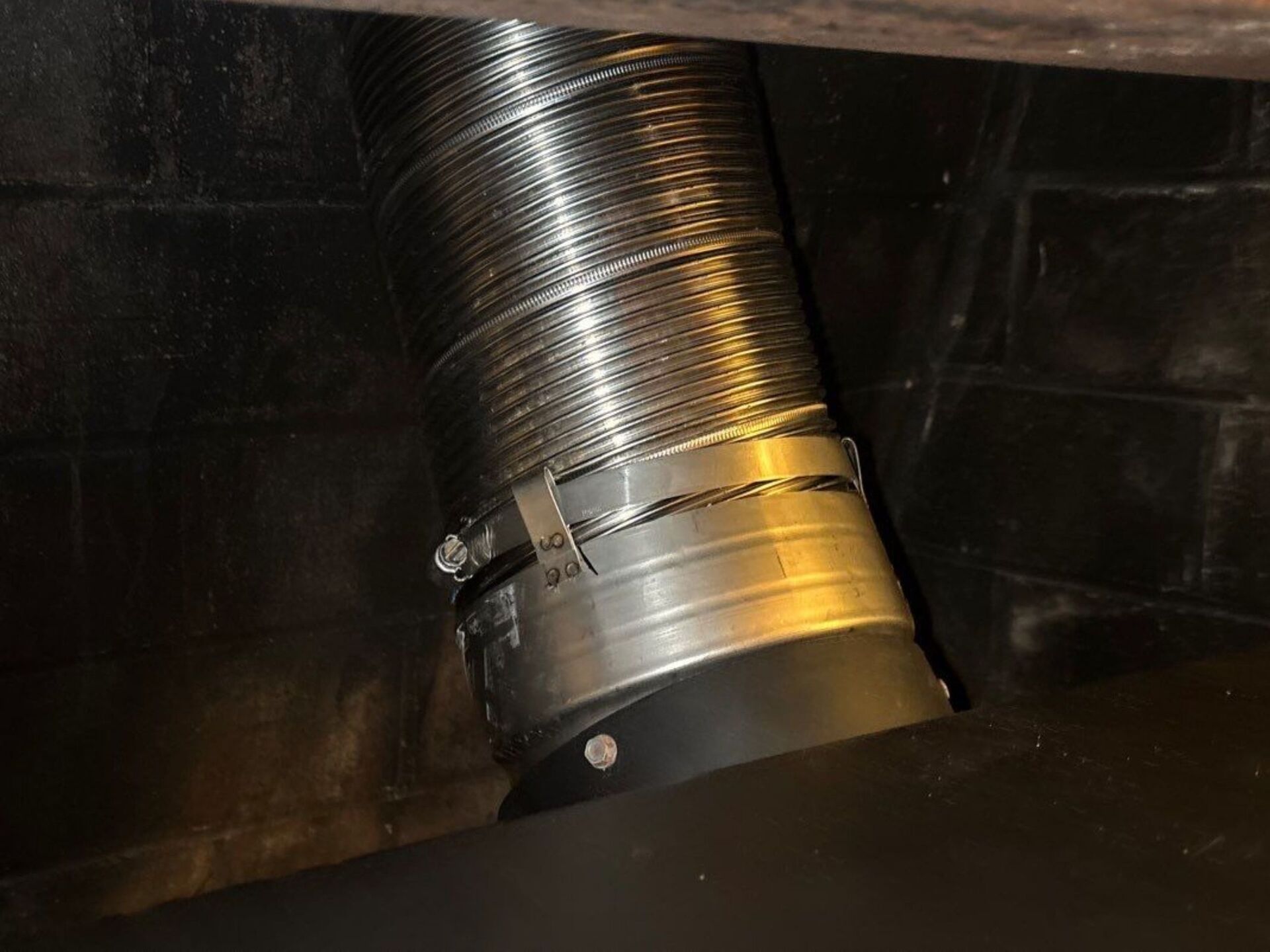 Installed oval-to-circle boot